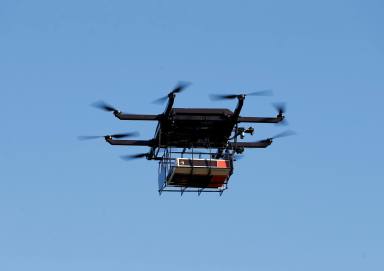 FILE PHOTO: A drone demonstrates delivery capabilities from the top of a UPS truck during testing in Lithia, Florida