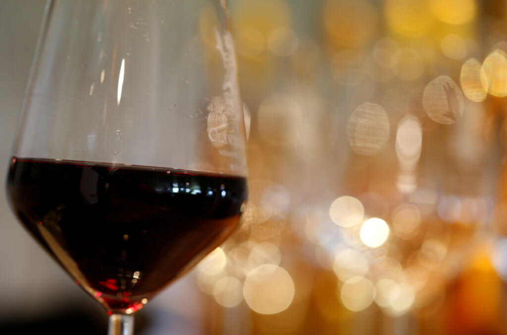 FILE PHOTO: A glass of French red wine is displayed at the Chateau du Pavillon in Sainte-Croix-Du-Mont,