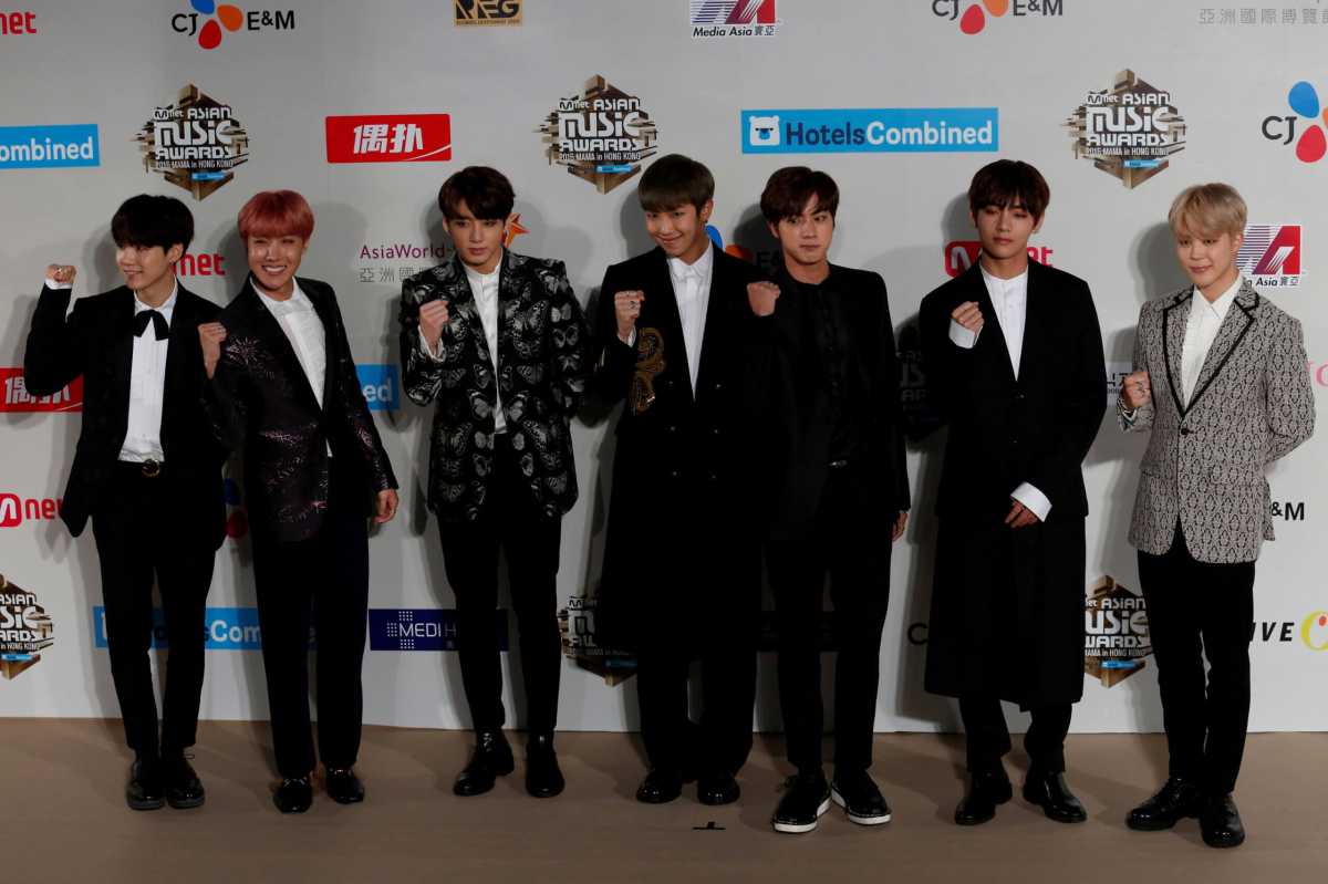 FILE PHOTO: Members of South Korean K-pop band BTS pose during Mnet Asian Music Awards in Hong Kong