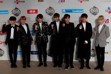 FILE PHOTO: Members of South Korean K-pop band BTS pose during Mnet Asian Music Awards in Hong Kong