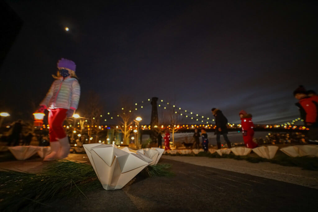 Families celebrate the first Winter Solstice Lantern Festival and labyrinth of light at Domino Park 2
