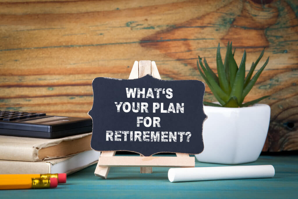 What’s Your Plan for Retirement. small wooden board with chalk on the table