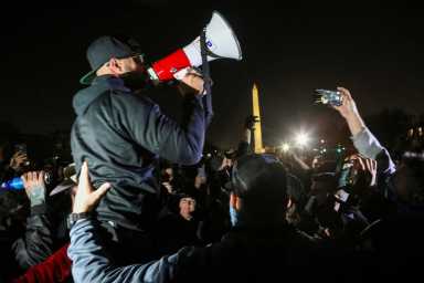 FILE PHOTO: Supporters of U.S. President Donald Trump and members of the far-right Proud Boys demonstrate, in Washington