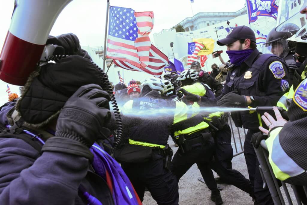 Supporters of U.S. President Donald Trump clash with police officers in front of the U.S. Capitol Building in Washington