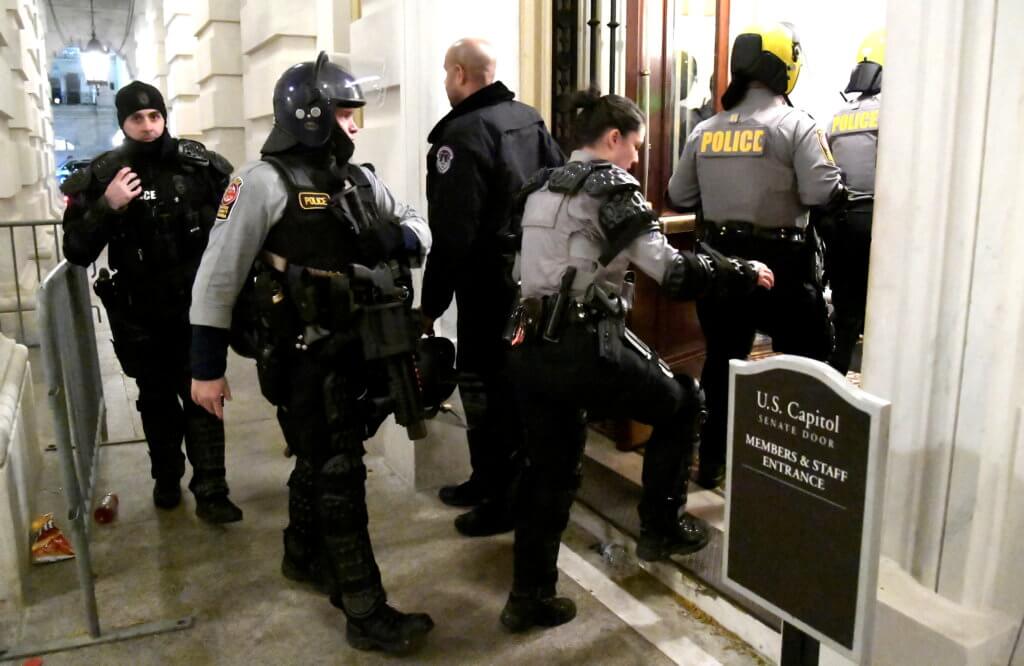Security is upgraded in aftermath of Trump supporters breeching the US Capitol