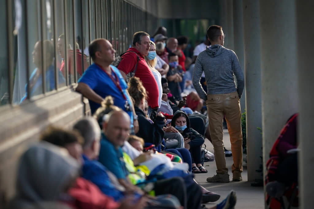 People wait outside Kentucky Career Center in Frankfort