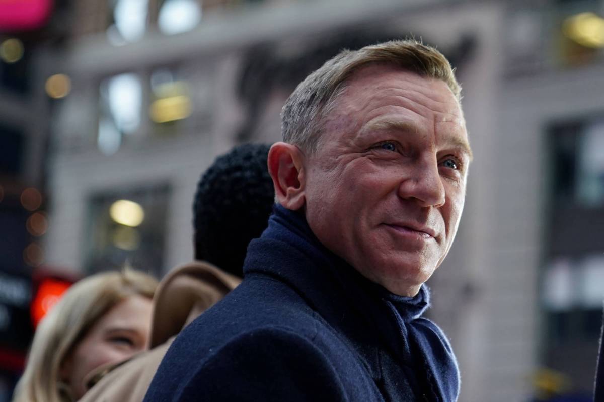 FILE PHOTO: Actor Daniel Craig reacts during a promotional appearance on TV in Times Square for the new James Bond movie “No Time to Die