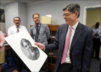 FILE PHOTO: Handout Photo shows U.S. Secretary Lew looking at rendering of Harriet Tubman during visit to the Bureau of Engraving and Printing in Washington