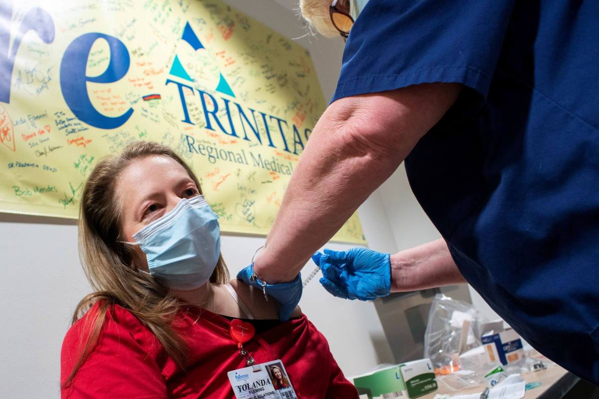 FILE PHOTO: A healthcare worker gets vaccinated at the Trinitas Regional Medical Center in Elizabeth, New Jersey
