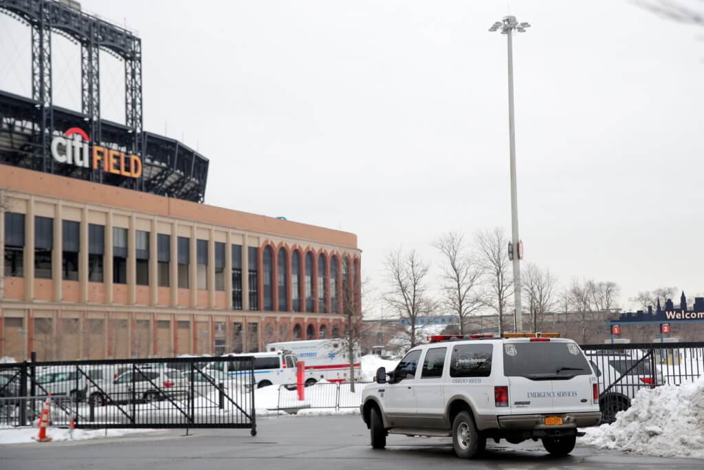 An emergency services vehicle is seen outside Citi Field,  the home stadium of the MLB’s New York Mets one day ahead of the opening of a portion of the baseball park as a COVID-19 mass vaccination site in Queens, New York