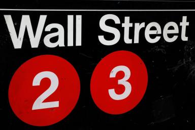 FILE PHOTO: A sign for the Wall Street subway station is seen in the financial district in New York