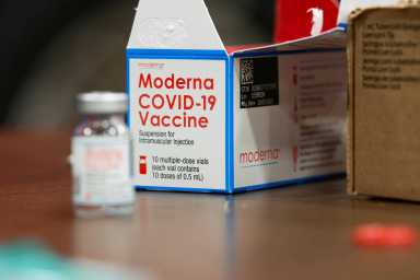 FILE PHOTO: People are inoculated against the coronavirus disease (COVID-19) in Arlington