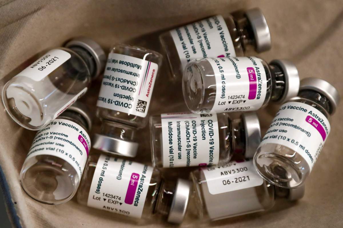 FILE PHOTO: Empty vials of AstraZeneca COVID-19 vaccine are seen in a tray