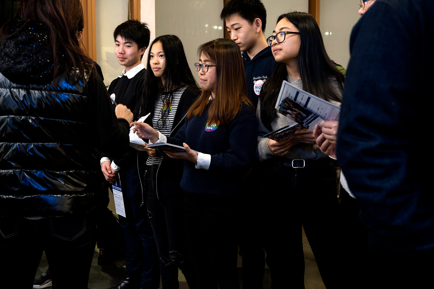 A team of high school volunteers and interns handing out campaign brochures and stickers. Photo by Tsubasa Berg