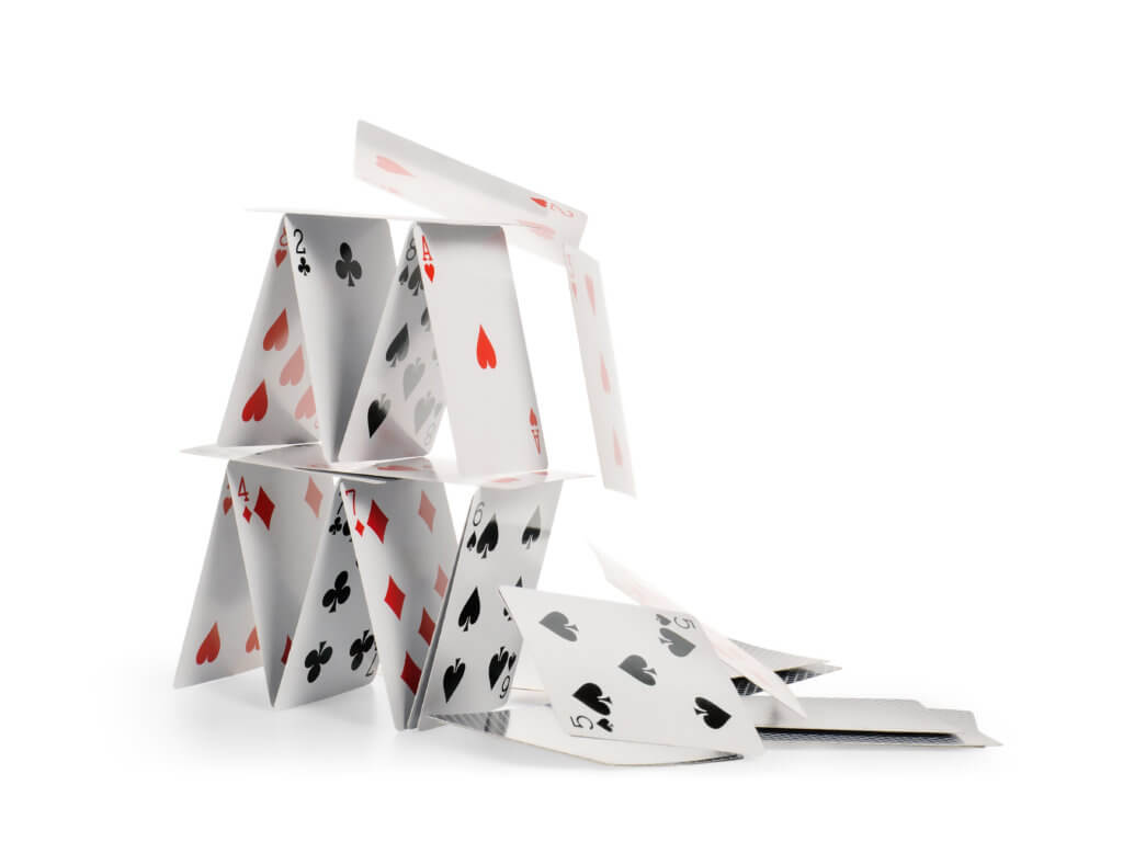 Editorial | Following the facts 1 Falling house of cards isolated with clipping path
