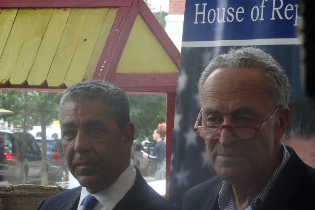 Rep. Adriano Espaillat and Sen. Charles Schumer reassure the public of the DR's safety (photo by William Engel)