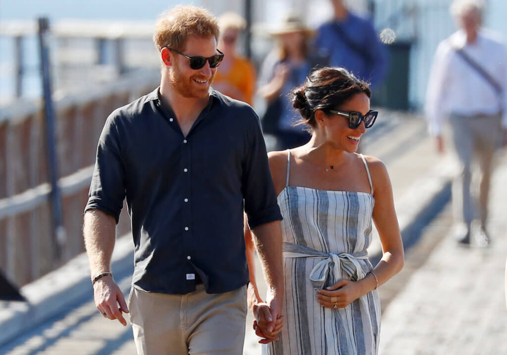 FILE PHOTO: Britain’s Prince Harry and Meghan, Duchess of Sussex, arrive to greet members of the public in Kingfisher Bay on Fraser Island in Queensland