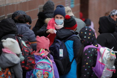 Students are greeted as they return to New York City’s public schools for in-person learning, as the global outbreak of the coronavirus disease (COVID-19) continues, at P.S. 506 in Brooklyn, New York