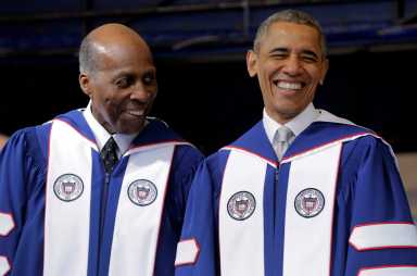 FILE PHOTO: U.S. President Barack Obama smiles as he speaks with Vernon Jordan before delivering the commencement address to the 2016 graduating class of Howard University in Washington