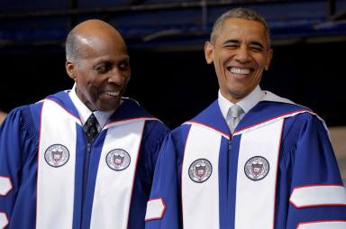 FILE PHOTO: U.S. President Barack Obama smiles as he speaks with Vernon Jordan before delivering the commencement address to the 2016 graduating class of Howard University in Washington