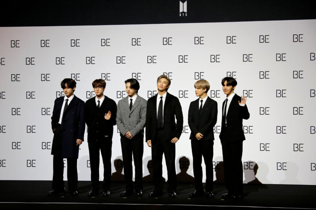 FILE PHOTO: Members of K-pop boy band BTS pose for photographs during a news conference promoting their new album “BE(Deluxe Edition)” in Seoul