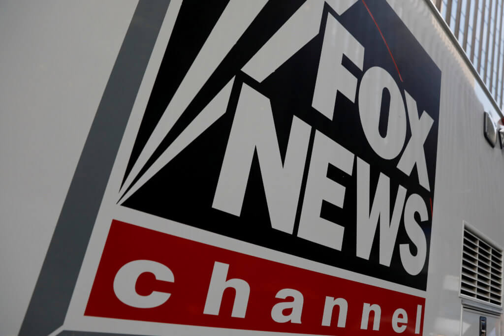 FILE PHOTO: FILE PHOTO: A Fox News channel sign is seen on a television vehicle outside the News Corporation building in New York City, in New York