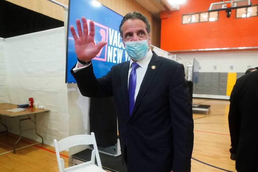 FILE PHOTO: New York Governor Andrew Cuomo waves goodbye as he departs an event in New York City