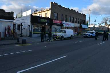Cops investigate a deadly shooting in City Line, Brooklyn on March 7, 2021.