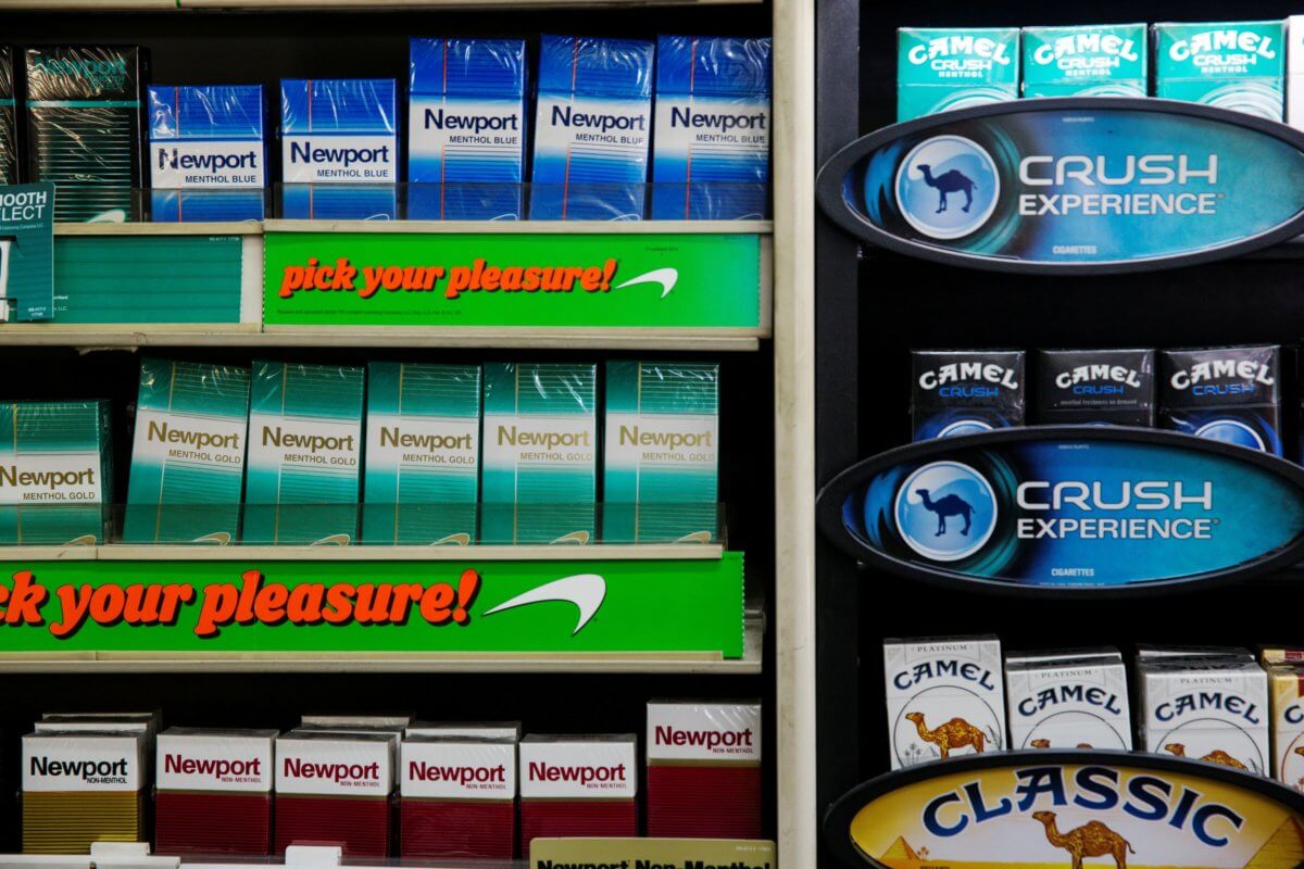 FILE PHOTO: Newport and Camel cigarettes are stacked on a shelf inside a tobacco store in New York