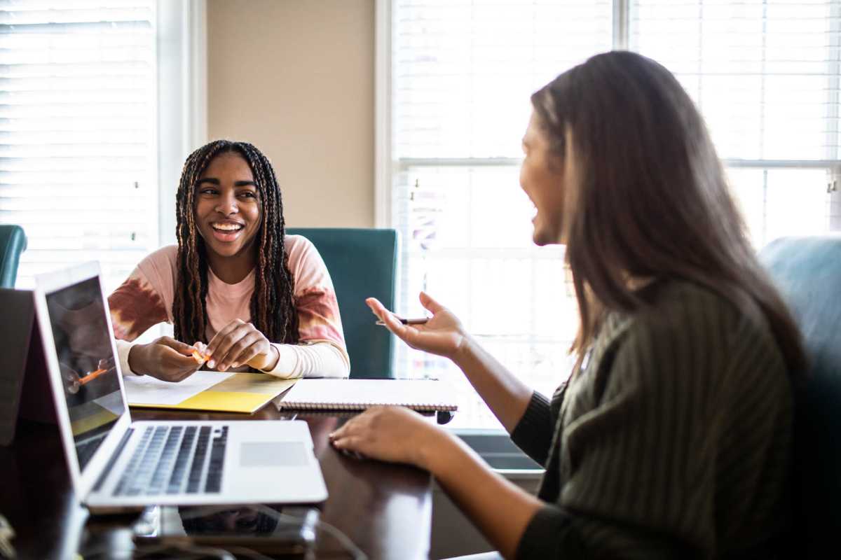 Teenage girls studying at home
