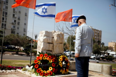 A man stands still as a two-minute siren marking the annual Israeli Holocaust Remembrance Day is heard in Ashkelon