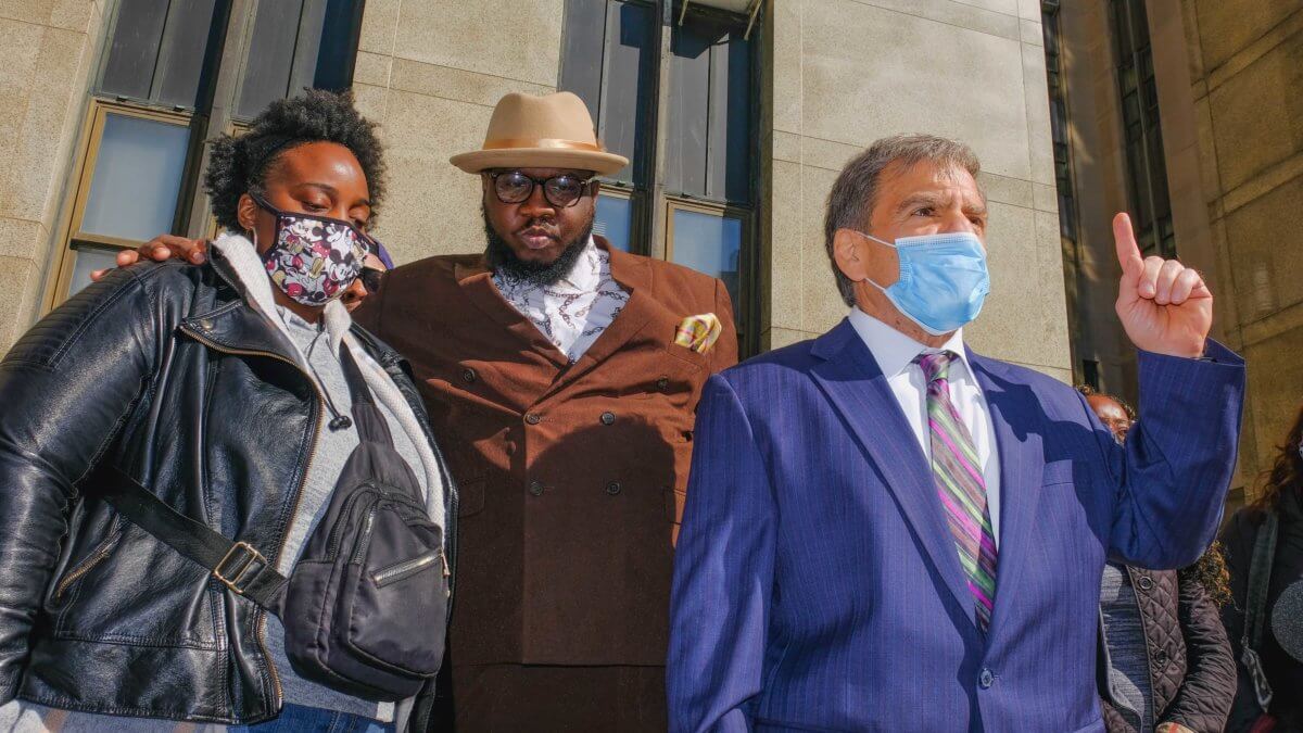 Elayna Mason (left), Reverend Kevin McCall and attorney Ben Pinczewski (right) on April 29 in front of the Manhattan District Attorney’s office.