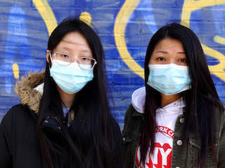 Sixteen-year-old Vanessa Chen stands with her mother, Fiona Lam