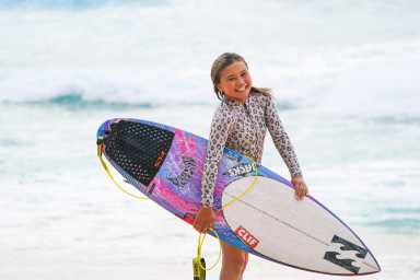 Skateboarding sensation Sky Brown, 12, surfs in Oahu