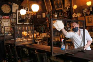 Restrictions ease for bars, allowing seating at the bar, during the coronavirus disease (COVID-19) in Manhattan, New York City.