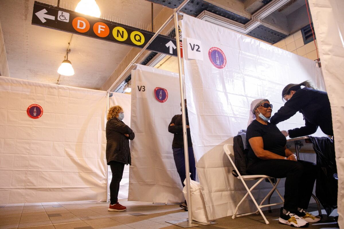 A commuter receives free vaccination for the coronavirus disease (COVID-19) at the Coney Island subway station in Brooklyn, New York