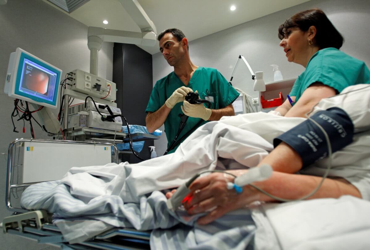FILE PHOTO: A French doctor performs a colonoscopy on a patient at the Ambroise Pare hospital in Marseille
