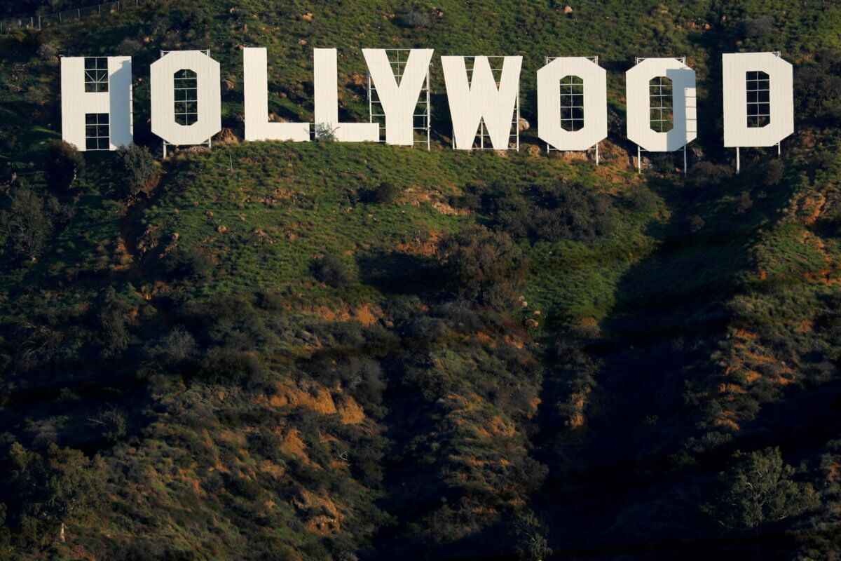 FILE PHOTO: The iconic Hollywood sign is shown on a hillside above a neighborhood in Los Angeles
