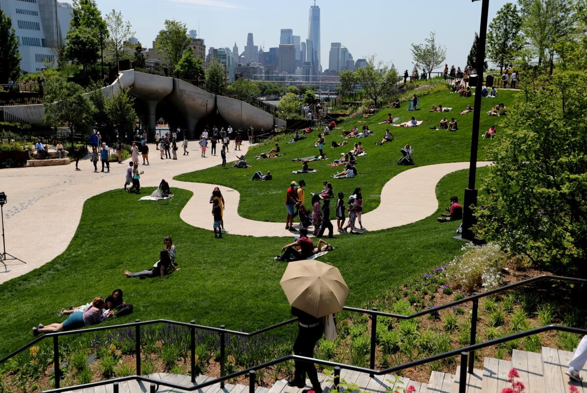 People visit Little Island Park, a new public park space which sits on stilts over the Hudson River during opening day in New York