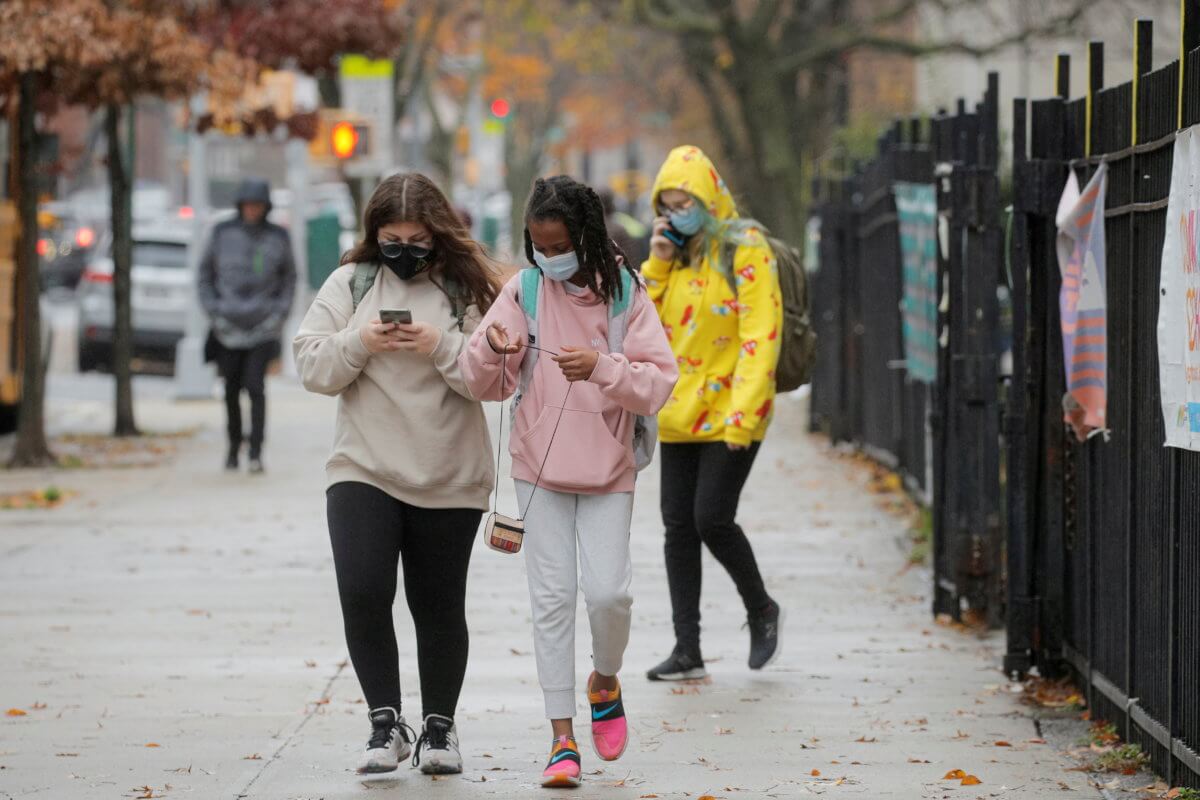 FILE PHOTO: Students exit a school as the spread of coronavirus disease (COVID-19) continues, in Brooklyn, New York