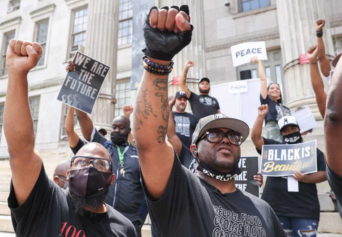 Terrence Floyd, brother of George Floyd, raises his fist after speaking at a memorial and rally in New York City