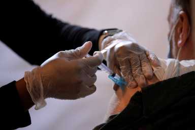 Commuter receives free vaccination for the coronavirus disease (COVID-19) at subway station in Brooklyn borough of New York City