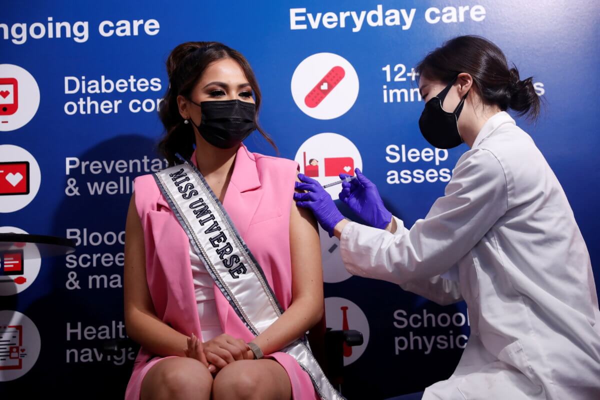 Miss Universe Andrea Meza, of Mexico, winner of the 69th annual Miss Universe competition, receives a dose of the Pfizer-BioNTech vaccine for the coronavirus disease (COVID-19) at a CVS Pharmacy store in the Manhattan borough of New York City