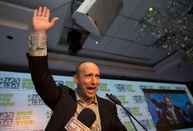FILE PHOTO: Head of the Bayit Yehudi party Bennett waves to supporters at his party’s headquarters in Ramat Gan