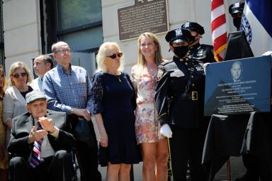 The Simsonsen family with the dedicated plaque to Detective Brian Simonsen.