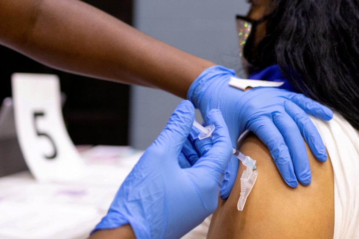 FILE PHOTO: A woman receives a COVID-19 vaccine at a clinic in Philadelphia