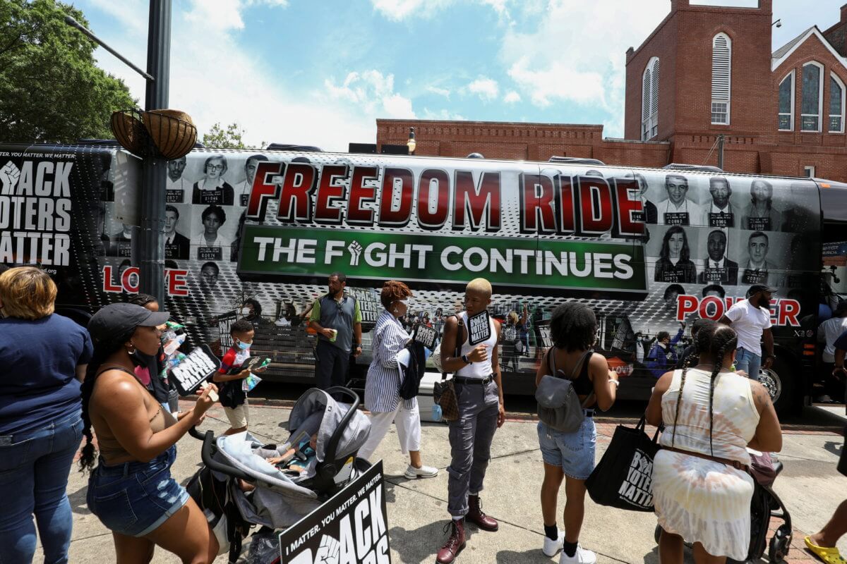 People gather at Ebenezer Baptist Church during a stop on the Freedom Ride For Voting Rights in Atlanta