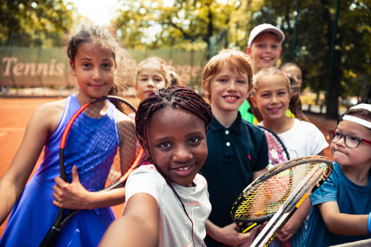 Kids having a selfie playing tennis