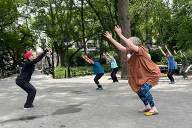 Naomi Goldberg Haas leads the series of exercises, including modified squats.