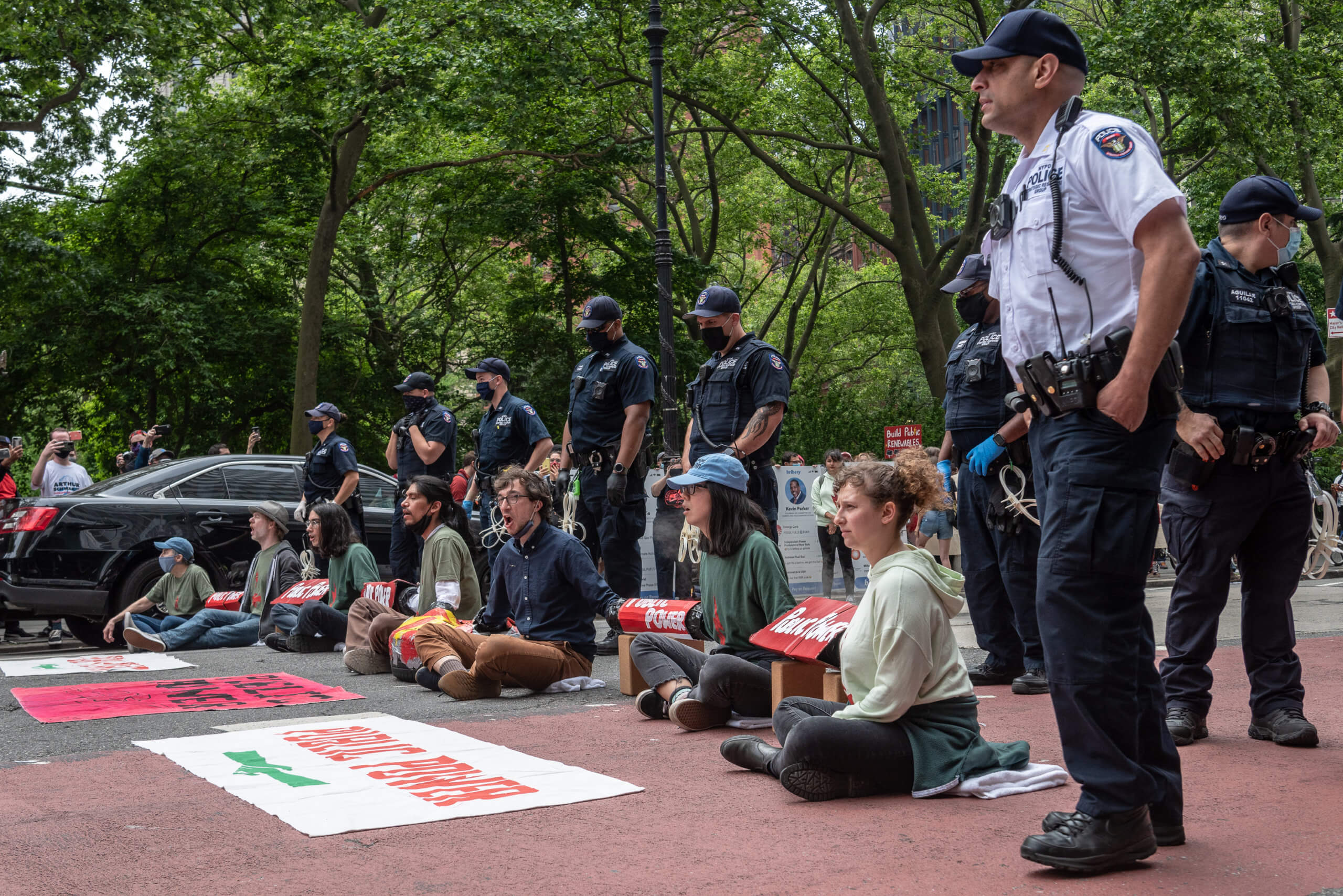 Climate activists cuffed at Downtown protest over Public Renewables Act 2